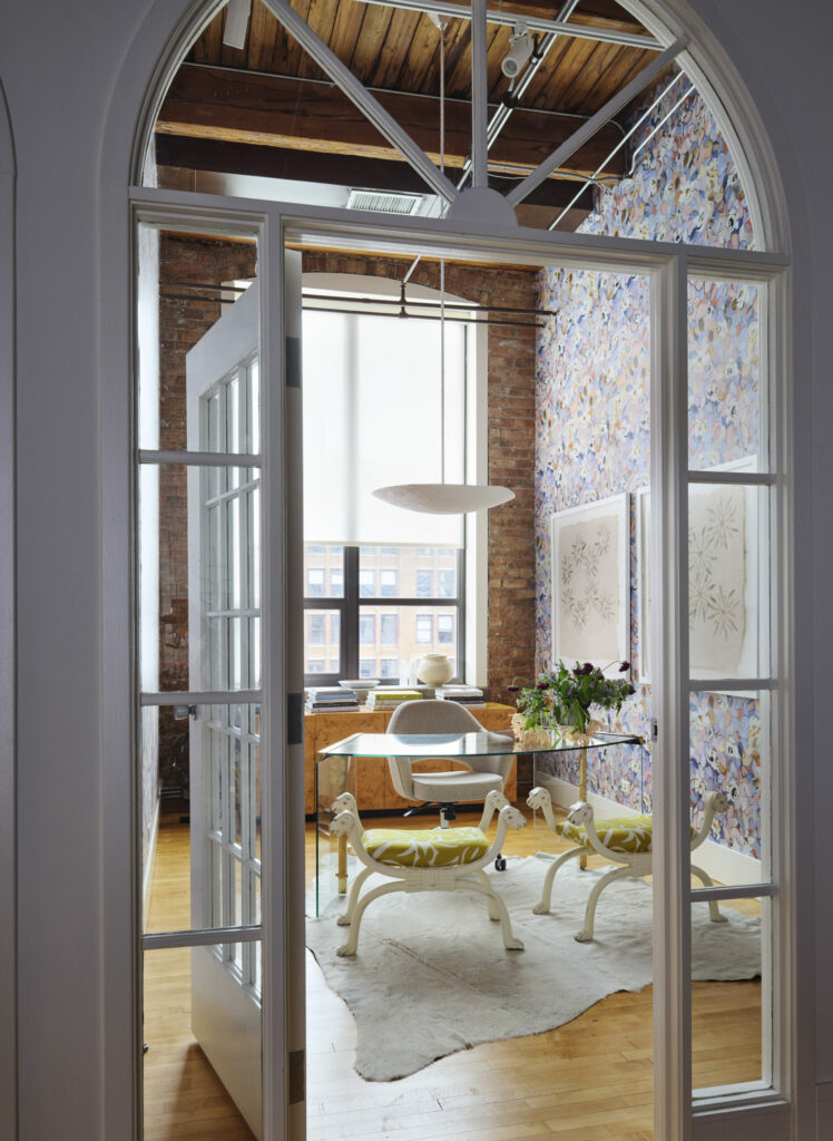 Interior design studio featuring arched doorway and luxurious office